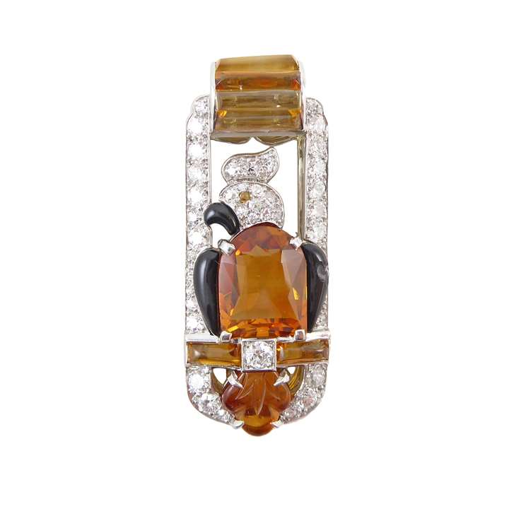 Art Deco citrine, diamond and black enamel bird clip brooch designed as a stylised parrot upon a perch